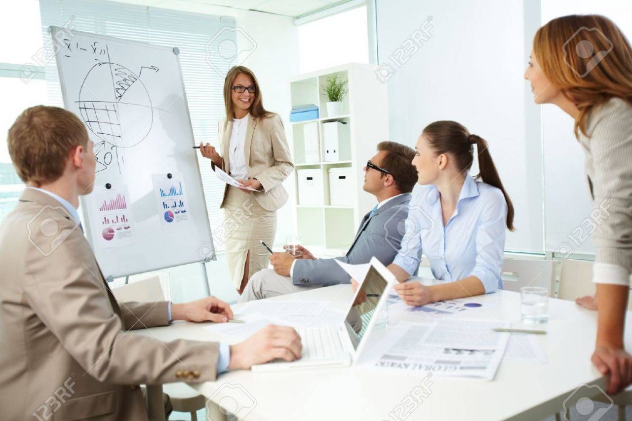 https://udvi.xyz/wp-content/uploads/13729495-confident-top-manager-standing-by-the-whiteboard-and-explaining-her-strategy-at-meeting-1280x853.jpg