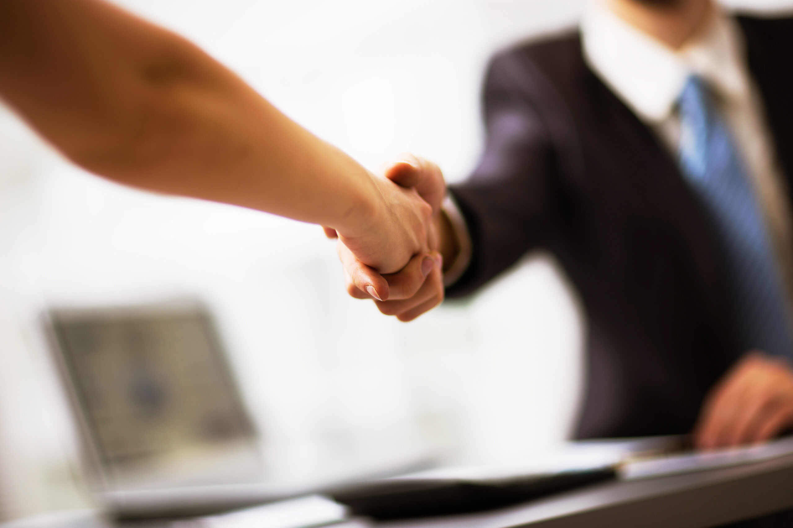 Business people shaking hands, finishing up a meeting